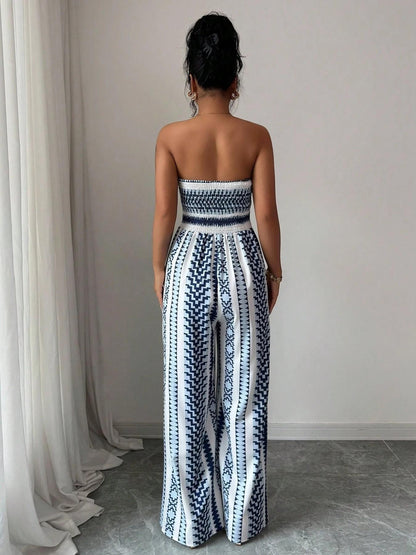 👗 50% DE RÉDUCTION 💥 Combinaison motifs géométriques – Encolure dos nu & fente latérale – Tissu fluide, polyvalente – parfaite pour les soirées ou les vacances ✨