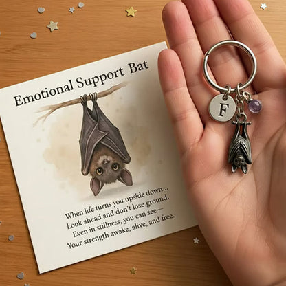Porte-clés chauve-souris offrant un soutien émotionnel et une carte avec un message